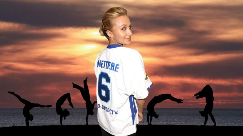 Hayden Panettiere looks back over her shoulder while wearing a jersey with her name on it.