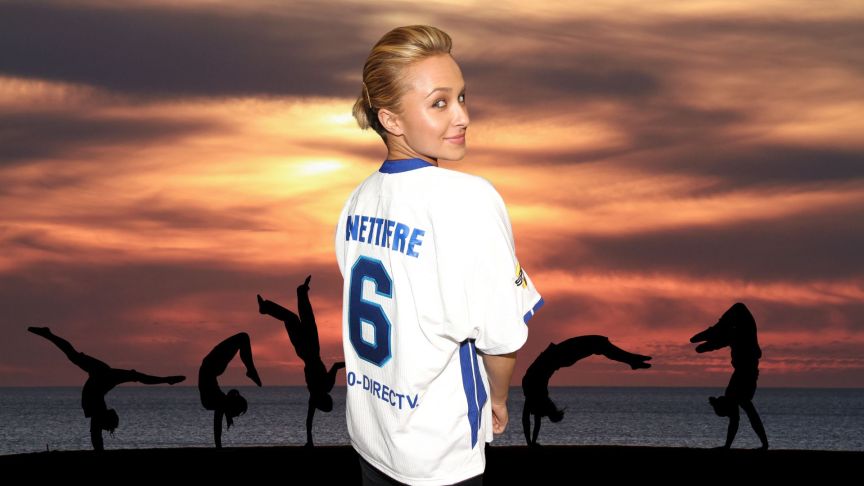 Hayden Panettiere looks back over her shoulder while wearing a jersey with her name on it.