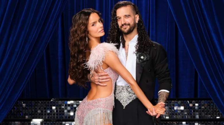 Maura Higgins holds hands with Mark Ballas in dance attire.