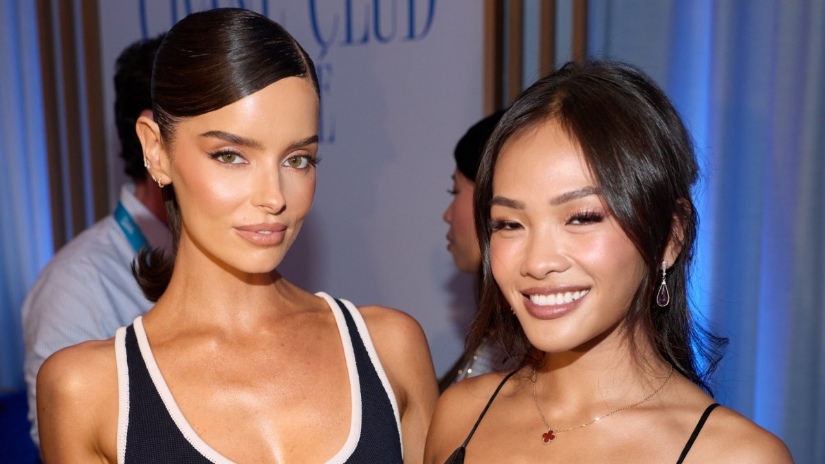 Maura Higgins and Jenn Tran stand beside each other in black outfits.
